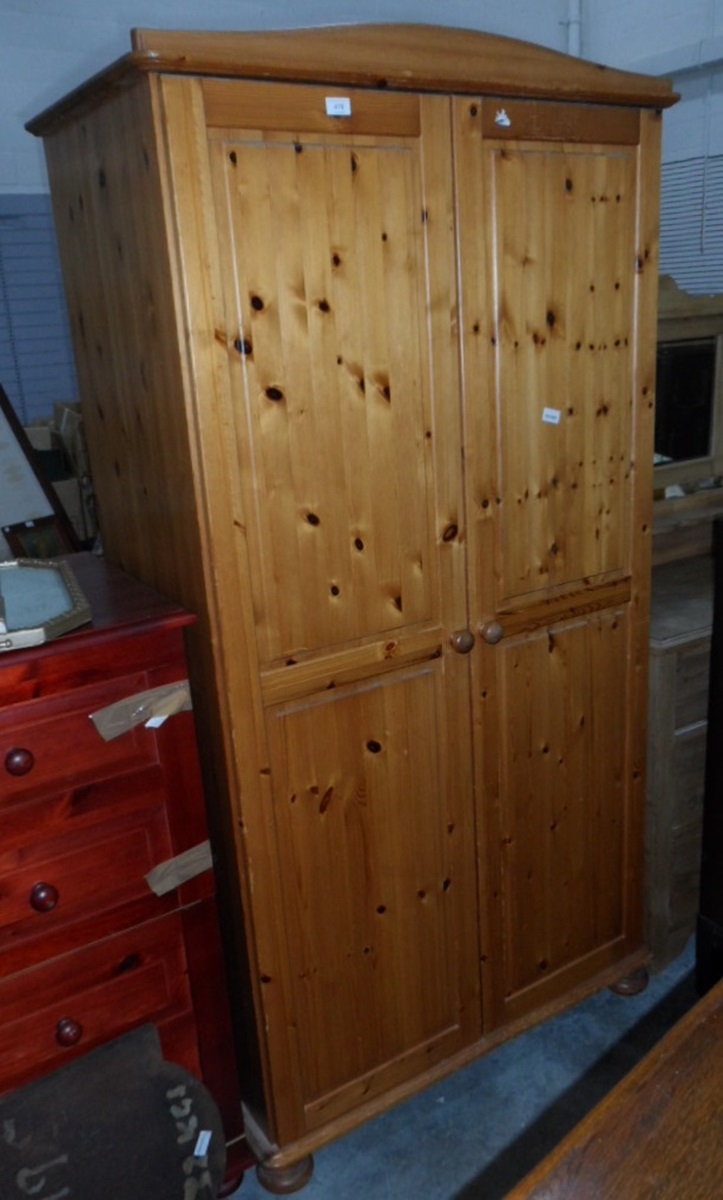 A pine two-door wardrobe,