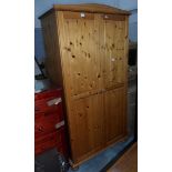 A pine two-door wardrobe,