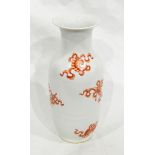 A Chinese porcelain vase of baluster form with iron red decoration including emblems of carp,