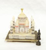 A miniature alabaster model of the Taj Mahal with painted decoration, 13cm high approx.