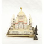 A miniature alabaster model of the Taj Mahal with painted decoration, 13cm high approx.