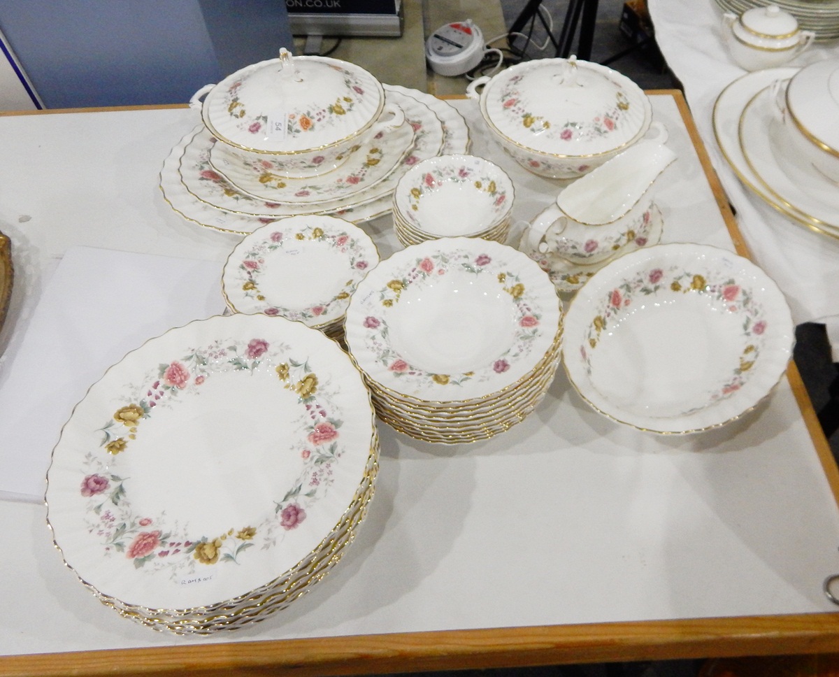 A Royal Doulton 'Rosell' pattern table service including vegetable dishes and covers,