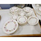 A Royal Doulton 'Rosell' pattern table service including vegetable dishes and covers,