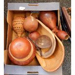 A quantity of African gourd vessels, vases, instruments and similar,