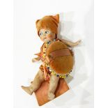 A small bisque doll pin cushion, the bisque doll with painted features, jointed limbs,