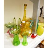 A Victorian cranberry glass bowl, a pearlised vase of lobed form, a pair of green flash cut bottles,