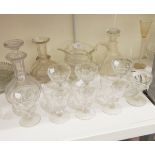 A pair of 19th century slab cut glass decanters, a 19th century cut glass jug, drinking glasses,