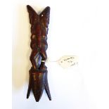 An African Warega carved hardwood double-sided figure group on pointed petal base,