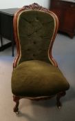 A mahogany drawing room chair with green woven cushion and back, scroll decoration,