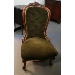 A mahogany drawing room chair with green woven cushion and back, scroll decoration,