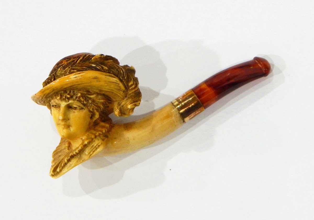 A Victorian carved meerschaum pipe, the bowl in the form of lady wearing large feathered hat,