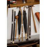 A quantity of various walking sticks,