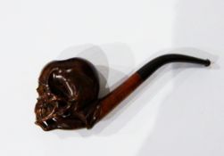 A carved wooden pipe, the bowl in the form of skull supported on lady's hand, the case marked "Gebr.