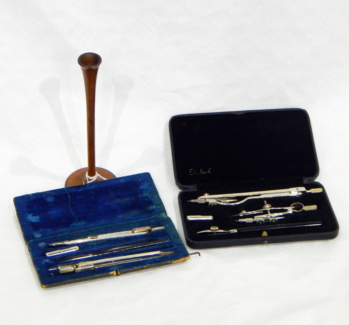 Two cased drawing instruments and a turned boxwood ear-trumpet