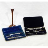 Two cased drawing instruments and a turned boxwood ear-trumpet