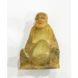 An Oriental carved jade seated figure of a sage,