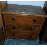 A 19th century pine chest of three graduating drawers with bun handles, on bun feet,