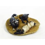 An Austrian cold painted bronze group of three kittens on straw boater