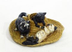 An Austrian cold painted bronze group of three kittens on straw boater