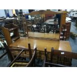 An oak dressing table with three short drawers and mirror to back,