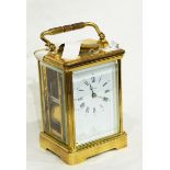 An Angelus brass repeater carriage clock,