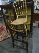 A gilt stickback chair, rush seated,