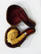 A carved meerschaum pipe in the form of lady's head wearing turban and flowers in her hair (cased)