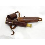 A brass leather-bound three-draw telescope by B C Limited & Co, no.