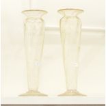 A pair of large glass vases, each of fluted form with cut glass foliage and details,