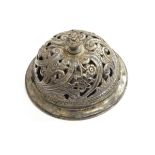 A late Victorian silver table bell, Sheffield 1900, of circular form with pierced floral decoration,