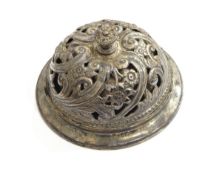 A late Victorian silver table bell, Sheffield 1900, of circular form with pierced floral decoration,