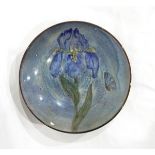 A Chelsea Pottery bowl decorated with an iris and butterfly,