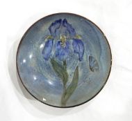 A Chelsea Pottery bowl decorated with an iris and butterfly,