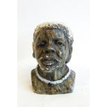 An African mottled green hardstone bust of a man wearing necklace, probably Shona,