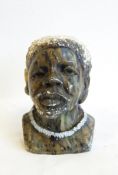 An African mottled green hardstone bust of a man wearing necklace, probably Shona,