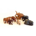 A quantity of carved wooden elephants,