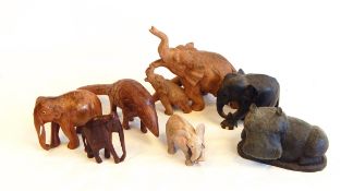 A quantity of carved wooden elephants,