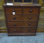 A late 19th century mahogany chest of two short and three graduated drawers, with bun handles,
