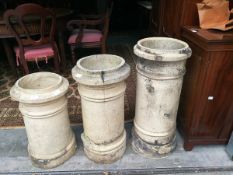 Three chimney pots in various sizes