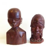 An African carved wood bust of female figure wearing brass earrings and an African terracotta bust