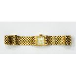A lady's gold-coloured bracelet watch with integral brick link bracelet, marked 14K,