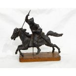A heavy pewter type metal sculpture of warrior in armour on horseback, on wooden plinth base,