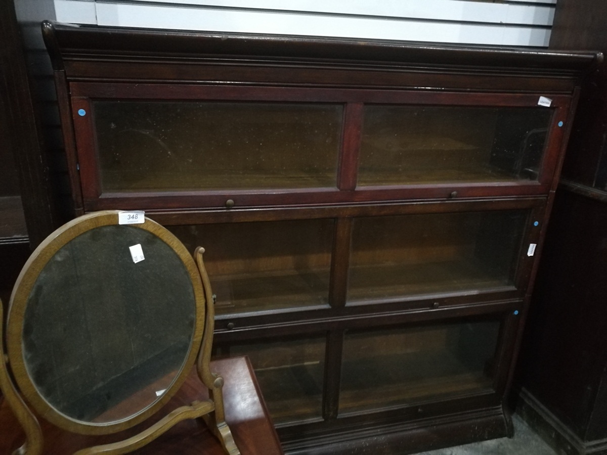 A Globe Wernicke style stained wood three section glazed bookcase,