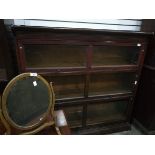 A Globe Wernicke style stained wood three section glazed bookcase,
