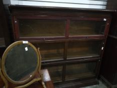 A Globe Wernicke style stained wood three section glazed bookcase,