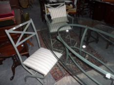 A painted metal and glass dining table and set of six chairs