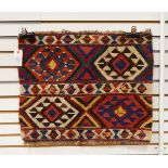 An Anatolian Kelim bedding bag face with two bands of coloured geometric decoration,