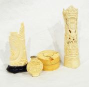 An Indian carved ivory figure of goddess with pierced decoration, an Oriental carved snuff bottle,