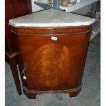 A mahogany bowfront corner cupboard with marbled top, raised on bracket feet,