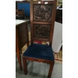 A pair of oak high-back chairs with two carved panels depicting gods and goddesses (old marks and